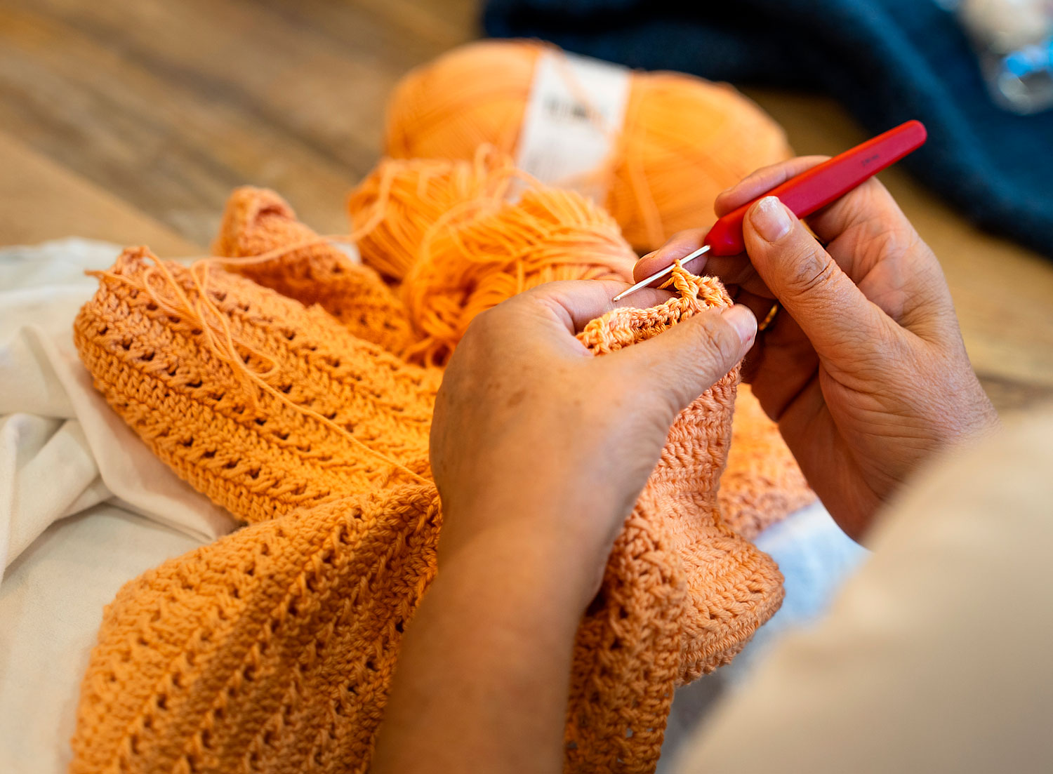 “Beginner-friendly 1.5-hour crochet class at Maker Studio Eastbourne , small welcoming workshop with tutor Kate teaching basic crochet stitches, providing yarn, hooks, and guidance, with participants taking home their completed projects and instructions.