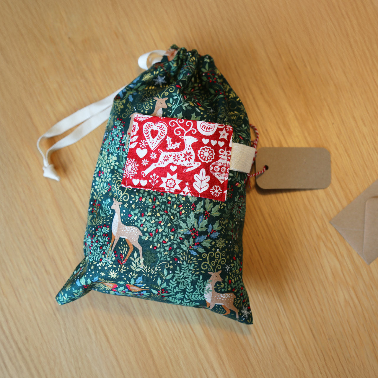 Beginners Christmas themed gift bag  using a sewing machine workshop at Maker Studio Eastbourne