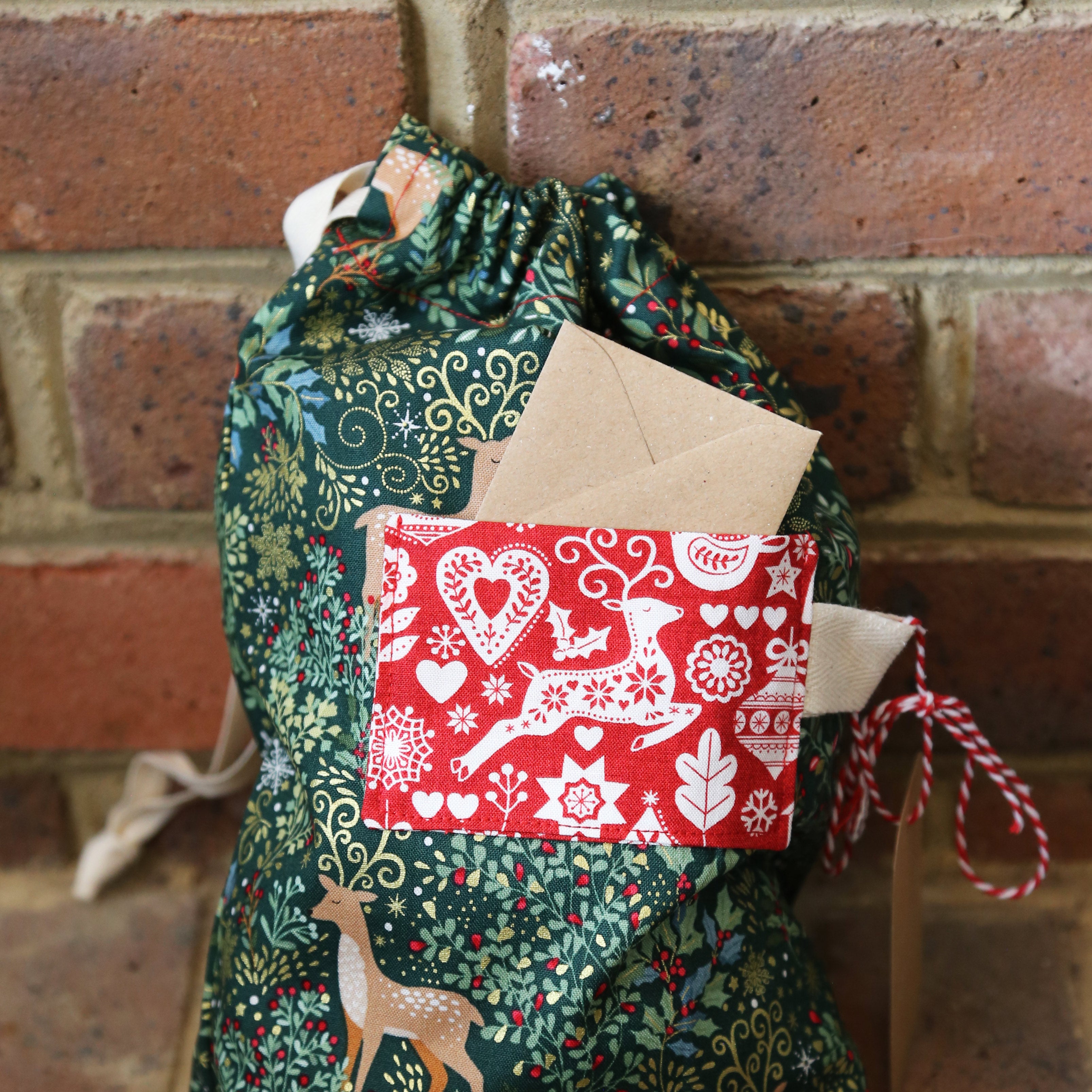 Beginners Christmas themed gift bag  using a sewing machine workshop at Maker Studio Eastbourne