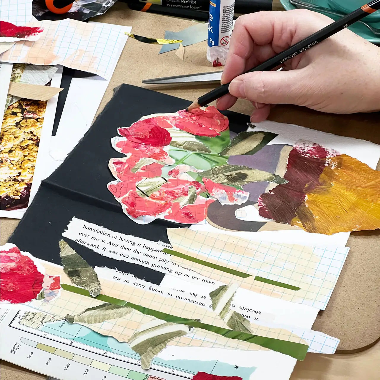 Collage art project with floral elements and text on a wooden surface.